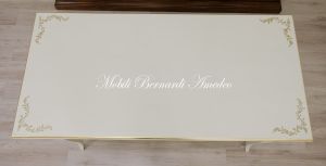 Classic style desk with colored lacquered finish with gold leaf decorations and frames